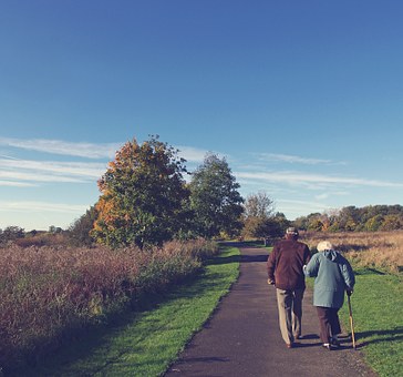 exercise for elderly walking together through park